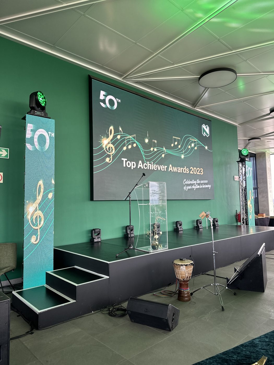 Top Achiever Awards 2023 stage build with LED backdrop, moving head lights and podium, set up by Conference Rentals